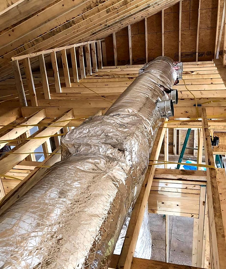 Insulated trunk ductwork installed in a new construction attic