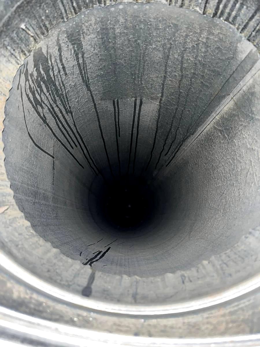 Inside a duct showing buildup on the metal