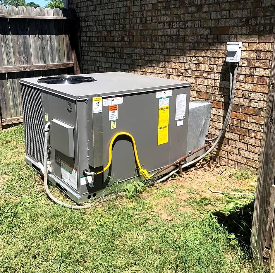 Package heating and cooling unit installed at a brick home